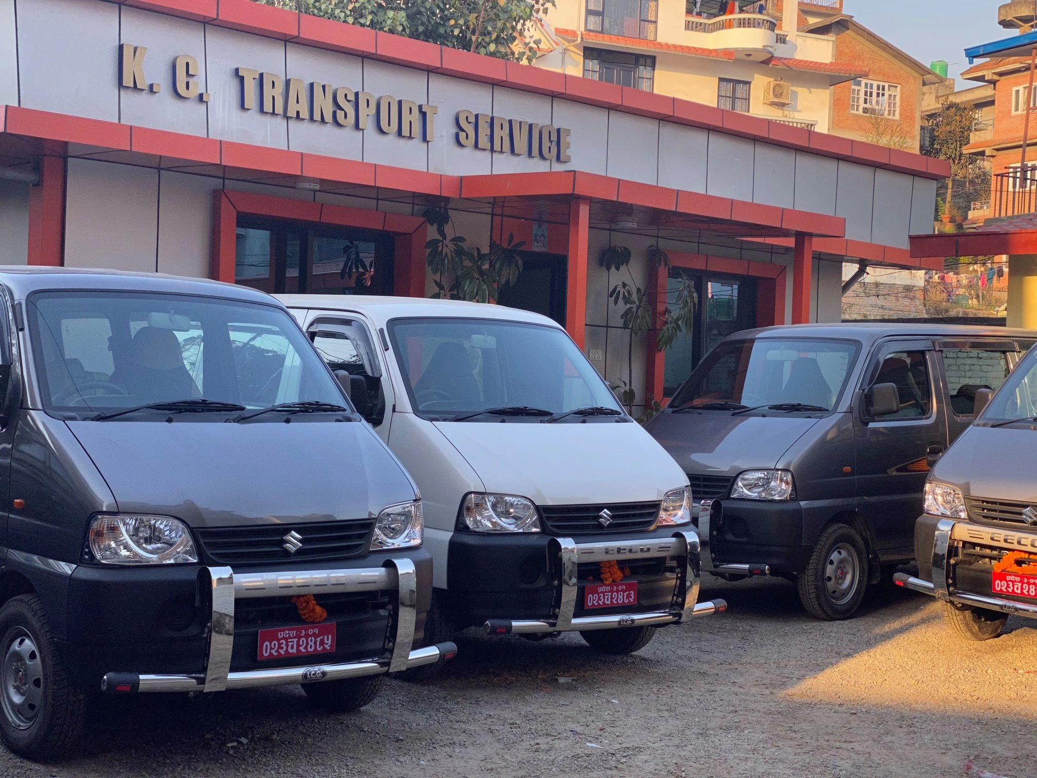 KC Transport Services team and vehicles